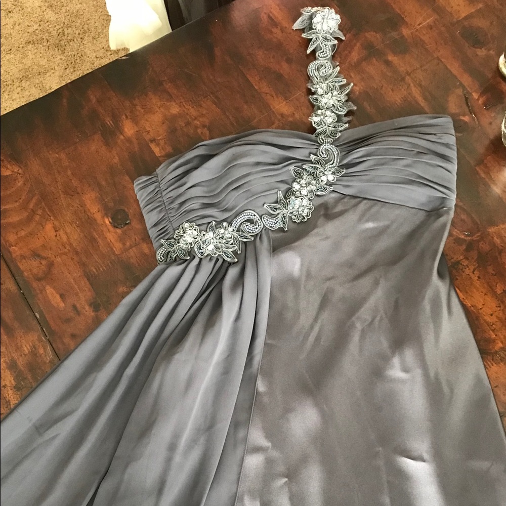 Woman’s silver strapless cocktail dress